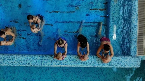 Mothers with children in the pool Stock Footage 125072161