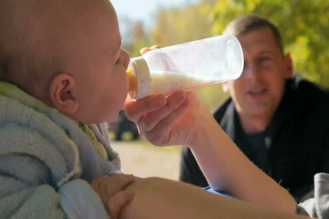 Mother's hand feeding baby Stock Footage