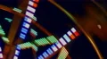 Motin Blurred Illuminated Ferris Wheel and Moon 4k or 4k+ Resolution