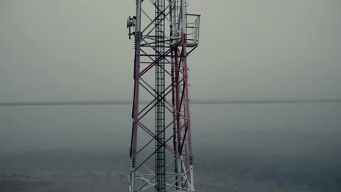 Motion up along contemporary cell tower on coastal area 스톡 동영상 146325756