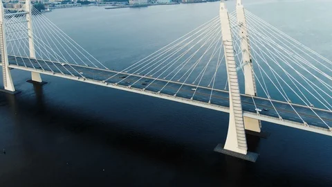 Motion along modern cable-stayed bridge against cityscape Stock Footage 109517262
