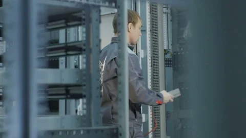 Motion along Racks and Backside View Technicians at Mining Farm Stock Footage 79433002