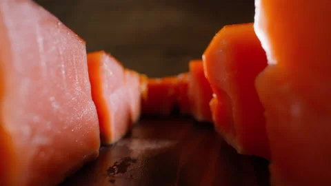 Motion along rows of cool smoked salmon cubes on table 스톡 동영상 164113049