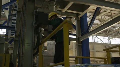 Motion along Skilled Worker Operating with Control Panel Stock Footage 79207680