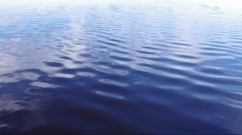 Motion along the surface of the water of a river or lake close Stock Footage 51534150