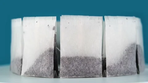 Motion around ring made of natural tea bags standing on tray Stock Footage 144438184