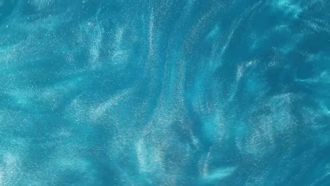 Motion background with blue water or blue liquid. Stock Footage 242104091