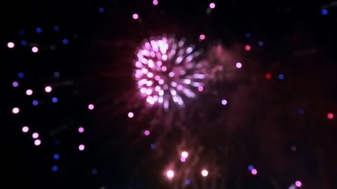 Motion background of defocused fireworks at night with colored bokeh sparkles Stock Footage 85269947