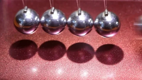The motion of balls in Newton's pendulum close up Stock Footage 82800753