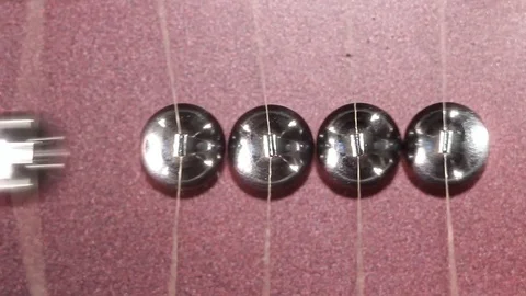 The motion of balls in Newton's pendulum, top viev Stock Footage 83274047