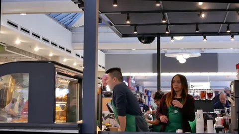 Motion of barista taking order and preparing coffee for customer Stock Footage 108758403