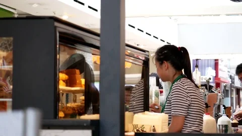Motion of barista taking order for customer at Starbucks store Stock Footage 75404263