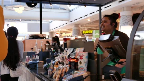 Motion of barista taking order for customer at Starbucks store Stock Footage 105448594