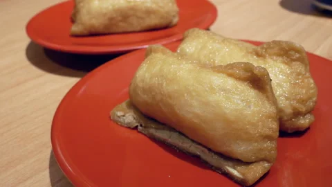 Motion of bean skin sushi on table in Japanese restaurant with 4k resolution Video stock 94163403