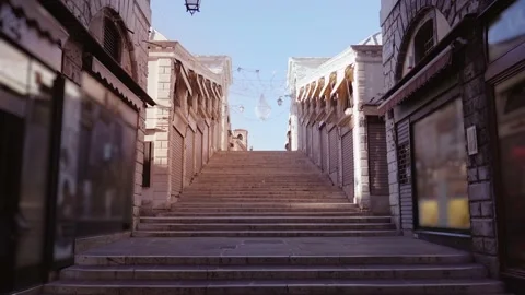 Motion between closed stores to steps of pedestrian Rialto Stock Footage 146396304