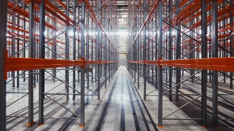 Motion between metal racks in modern spacious warehouse Stock Footage 120652354