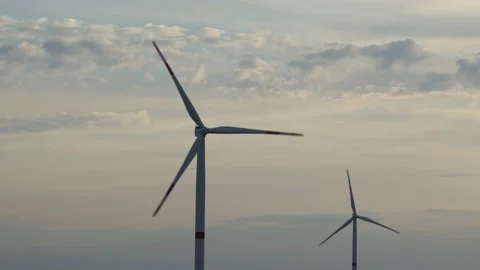 Motion the blades of a large wind turbine in a field against a background of Stock Footage 155295182