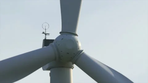 Motion the blades of a large wind turbine in a field against a background of Stock Footage 155295502
