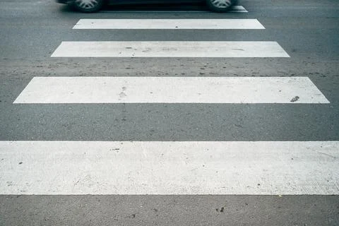Motion blur of a car driving over pedestrian zebra crossing, concept of tra.. 스톡 사진