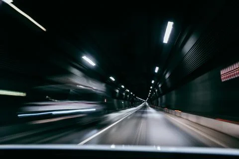 Motion blur of car moving inside tunnel Фото