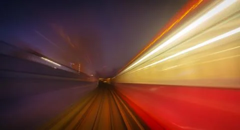 Motion blur of a DLR train on a tunnel Stock Photos