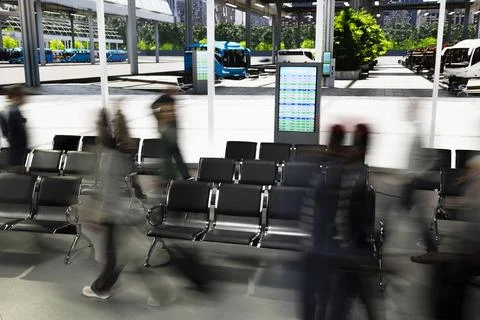Motion blur effect in crowded bus terminal with people walking quickly Stock Photos