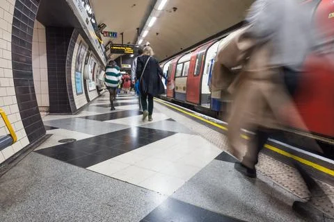 Motion blur of passengers during subway commute at London Tube station. London Stock Photos