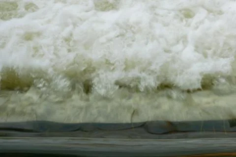 Motion blur of Powerful waves water with white foam rising up Stock Photos