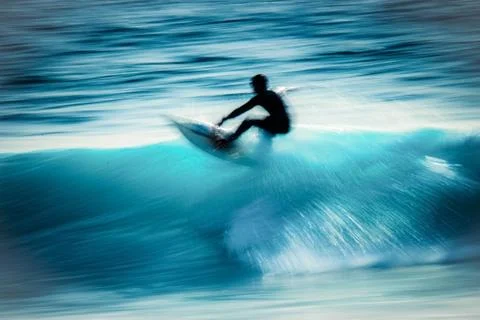 Motion blur of a surfer Stock Photos