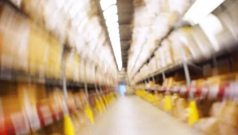 Motion Blurred Image Inside A Modern Warehouse. Stock Photos