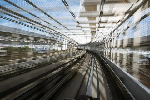 Motion-blurred view from a moving train running in tunnel Stock Photos