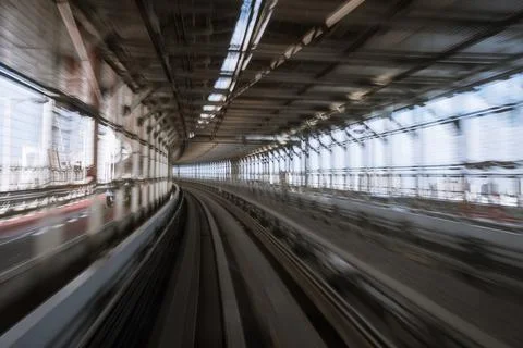 Motion-blurred view from a moving train running in tunnel 스톡 사진