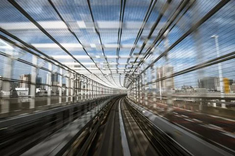 Motion-blurred view from a moving train running in tunnel Stock Photos