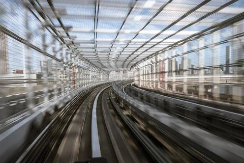Motion-blurred view from a moving train running in tunnel Stock Photos