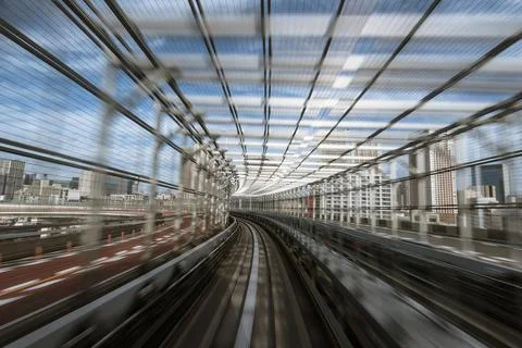 Motion-blurred view from a moving train running in tunnel Stock Photos