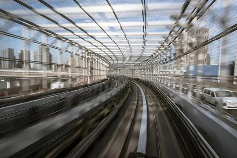 Motion-blurred view from a moving train running in tunnel Stock Photos