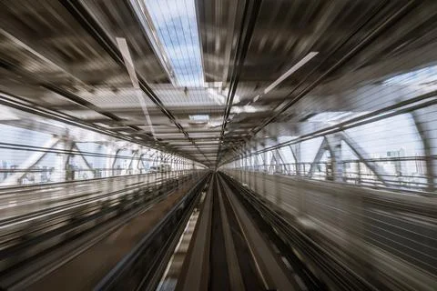 Motion-blurred view from a moving train running in tunnel Stock Photos