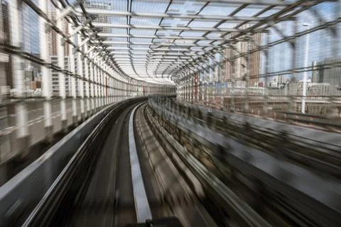 Motion-blurred view from a moving train running in tunnel Stock Photos