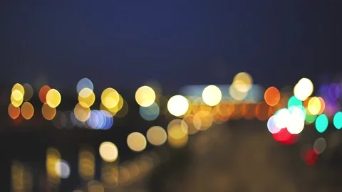 Motion blurry evening lights in the city. Bokeh from night lights fading into Stock Footage 159235051