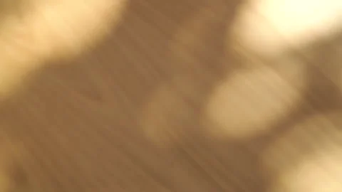 Motion of bokeh sunlight natural shadow overlay on wooden table texture backg Stock Footage 147646617