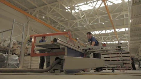 Motion from Bottom to Workers Operating with Machine Tool Stock Footage