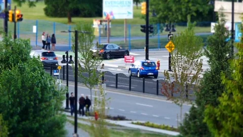 Motion of busy traffic flow and people walking into park for Canada day event Video stock 78115337