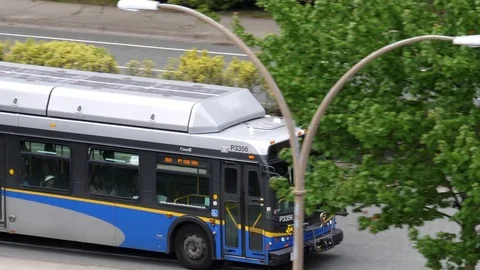 Motion of camera chasing bus on road in Coquitlam BC Canada. Video stock 76026965