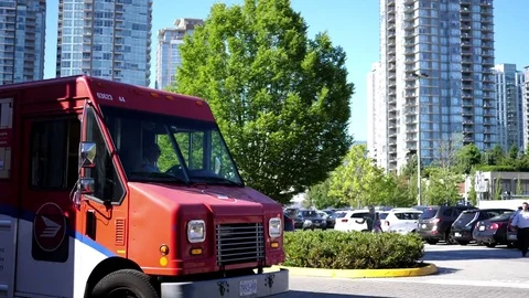 Motion of camera chasing Canada post car on road in Coquitlam BC Canada Stock Footage 77363346