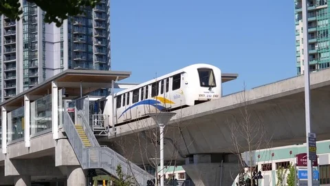 Motion of camera chasing skytrain left station in Coquitlam Evergreen line Video stock 76110552