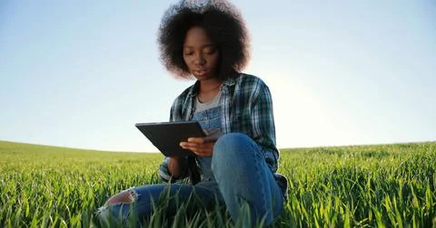 Motion camera view of the optimistic multiracial female farmer scientist using Stock Photos