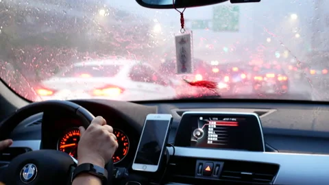 Motion of car driving on heavy raining day and focusing on car dashboard Video stock 94840344