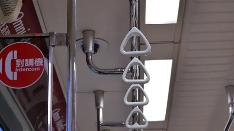 Motion of car handle and intercom sign inside skytrain Stock Footage 82505844