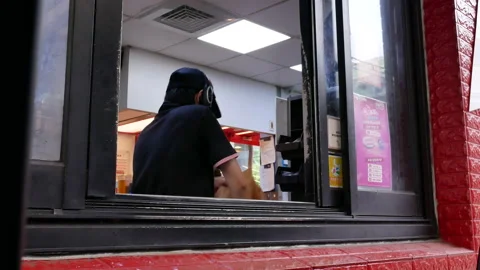 Motion of car in KFC drive through for picking up an order Stock-Footage 95765989