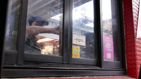 Motion of car in KFC drive through for picking up an order in Taipei Taiwan Video stock 95819623